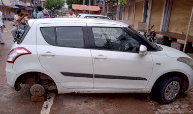 मुख्य बाजार में खड़ी कार के टायर व नम्बर प्लेट चोरी कर ले गए अज्ञात चोर